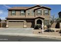 Two-story home boasts a three-car garage, tiled roof, and neutral-toned stucco at 6755 S Tucana Ln, Gilbert, AZ 85298