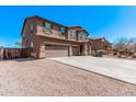 Lovely two-story home with a three-car garage and xeriscaped front yard at 6755 S Tucana Ln, Gilbert, AZ 85298