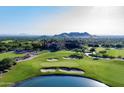 Panoramic aerial of the golf course and home with stunning mountain views at 6880 E Flat Iron Loop, Gold Canyon, AZ 85118