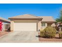 Cozy single-story house with a two-car garage and low-maintenance front yard at 10792 W Elm Ln, Avondale, AZ 85323