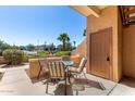 Cozy outdoor patio area featuring a glass table and four cushioned chairs at 16354 E Palisades Blvd # 3103, Fountain Hills, AZ 85268