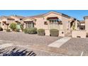 Inviting single-story home with decorative shutters, desert landscaping, and secure gated entry at 18254 N 136Th Ave, Sun City West, AZ 85375