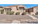 Charming single-story home with decorative shutters, well-kept bushes, and desert landscaping at 18254 N 136Th Ave, Sun City West, AZ 85375