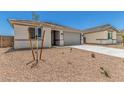 Single-story home with desert landscaping, concrete driveway, and neutral-colored exterior at 18347 W Monte Lindo Ln, Surprise, AZ 85387
