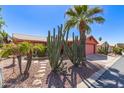 Beautiful desert landscaping frames this single-story residence with a two-car garage at 2101 S Meridian Rd # 60, Apache Junction, AZ 85120