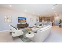 Inviting living room featuring modern furnishings, sleek entertainment center, and an open layout to the kitchen at 2121 W Sonoran Desert Dr # 47, Phoenix, AZ 85085