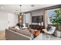 The stylish living room features a gray shiplap accent wall and elegant decor at 21236 N 58Th St, Phoenix, AZ 85054