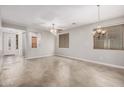 Bright living room with a ceiling fan, views to other rooms and natural light from two windows at 2242 W Calle Marita --, Phoenix, AZ 85085