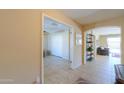 Hallway featuring arched entryways, tile flooring, and neutral tones that create a seamless flow throughout at 2369 E Fiesta Dr, Casa Grande, AZ 85194