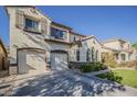 Charming home featuring a two-car garage, landscaped yard, stucco, and brown accents at 3816 E Phelps St, Gilbert, AZ 85295