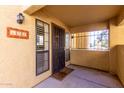 Charming condo front entryway with security screen door and stylish exterior lighting at 8314 N 21St Dr # K108, Phoenix, AZ 85021