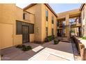 Attractive condo exterior with well-maintained walkways, access stairs, and tasteful architectural details at 8314 N 21St Dr # K108, Phoenix, AZ 85021