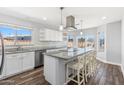 Spacious kitchen boasts white cabinets, gray countertops, and stainless steel appliances at 15848 N 32Nd Pl, Phoenix, AZ 85032