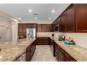 Spacious kitchen featuring granite countertops, stainless steel appliances, and ample cabinet space at 16390 W Sheila Ln, Goodyear, AZ 85395