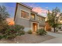 Charming two-story home with desert landscaping, tile roof, and a two-car attached garage at 1701 W Wildwood Dr, Phoenix, AZ 85045