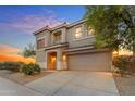 Stylish two-story home with a two-car garage, desert landscaping, and an inviting front entry at 1701 W Wildwood Dr, Phoenix, AZ 85045