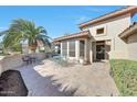 A private patio with seating provides a relaxing outdoor space in this charming desert home at 18102 N Petrified Forest Dr, Surprise, AZ 85374