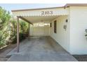 Attached covered parking area protecting vehicles from the elements with access to the home's entrance at 2163 W Flower St, Phoenix, AZ 85015