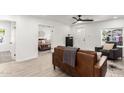 Open-concept living room with light wood floors and a view to the bedroom at 2512 N 29Th St, Phoenix, AZ 85008