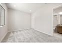 Neutral bedroom with carpet floors, natural light, and an ensuite bathroom at 26664 W Siesta Ln, Buckeye, AZ 85396