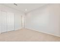 Carpeted bedroom featuring neutral walls and large, double door closet at 26903 W Renee Dr, Buckeye, AZ 85396