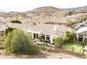 Back exterior featuring a private pool, landscaped yard and a covered patio perfect for outdoor dining at 301 E Ashurst Dr, Phoenix, AZ 85048