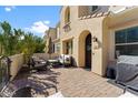 Cozy front patio featuring a paved area with patio furniture and a charming entryway at 4077 S Sabrina Dr # 23, Chandler, AZ 85248