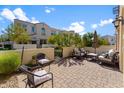 Private outdoor patio with brick pavers, seating area, and views of the surrounding neighborhood at 4077 S Sabrina Dr # 23, Chandler, AZ 85248