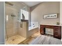 Modern bathroom with a glass shower, soaking tub, and sleek vanity at 4553 S Alamos Way, Gold Canyon, AZ 85118