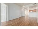 Spacious living room with wood floors, neutral walls and ample space at 6770 N 47Th Ave # 1022, Glendale, AZ 85301