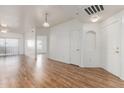 Bright living room with wood floors and sliding glass doors to patio at 6770 N 47Th Ave # 1022, Glendale, AZ 85301