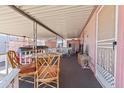 A covered porch with patio seating offering a relaxing outdoor space at 701 S Dobson Rd # 432, Mesa, AZ 85202