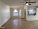 Open living space features tile floors, ceiling fan, dining area and access to the kitchen at 850 S River Dr # 2018, Tempe, AZ 85281