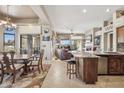 Open-concept living space with combined kitchen, dining area, and living room with balcony access at 13013 N Panorama Dr # 120, Fountain Hills, AZ 85268