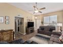 Inviting living room with comfortable furniture, wood-look flooring, and plenty of space at 14212 N Newcastle Dr, Sun City, AZ 85351