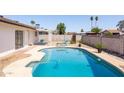 Inviting backyard pool with lounge chairs, surrounded by a well-maintained patio and block fencing for added privacy at 14803 N 55Th Ave, Glendale, AZ 85306