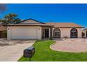 Charming single-story home features a well-kept lawn, gravel landscaping, and a convenient two-car garage at 15022 N 22Nd Ln, Phoenix, AZ 85023