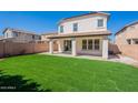 A well-maintained backyard and green lawn offer a great space for entertaining and outdoor enjoyment at 18123 W Lundberg St, Surprise, AZ 85388