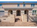 Charming front entrance featuring a paved walkway leading to the front door with stone pillar accents at 21256 E Waverly Dr, Queen Creek, AZ 85142