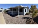Inviting home exterior with covered porch and xeriscaping for easy maintenance at 2233 E Behrend Dr # 85, Phoenix, AZ 85024
