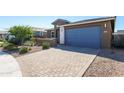 Lovely single-story home with stone driveway and desert landscaping at 22463 E Rosa Rd, Queen Creek, AZ 85142