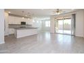 Open concept kitchen, stainless appliances, and island with bar stool seating at 22463 E Rosa Rd, Queen Creek, AZ 85142