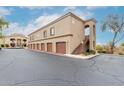 Building exterior shows multiple garages and private entryways, complete with well-maintained landscaping at 29606 N Tatum Blvd # 121, Cave Creek, AZ 85331