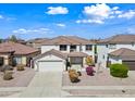 Two-story home with a two-car garage, tiled roof, and well-maintained landscaping at 3144 W Maya Way, Phoenix, AZ 85083