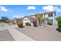 Charming two-story home with a two-car garage and beautiful desert landscaping at 3144 W Maya Way, Phoenix, AZ 85083