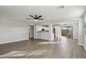 Open floor plan featuring living room, eat in kitchen and stainless steel appliances at 325 W Angus Rd, San Tan Valley, AZ 85143