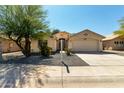 Charming single-story home with a neutral color scheme, desert landscaping, and a two-car garage at 399 W Buena Vista Dr, Tempe, AZ 85284
