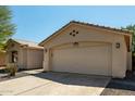 Charming single-story home with a neutral color scheme, desert landscaping, and a two-car garage at 399 W Buena Vista Dr, Tempe, AZ 85284