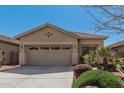 Inviting single-story home with a well-maintained front yard and attached two-car garage at 44215 W Granite Dr, Maricopa, AZ 85139