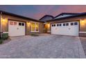 Charming exterior elevation featuring a large driveway and three-car garage at 4606 S Ferric --, Mesa, AZ 85212